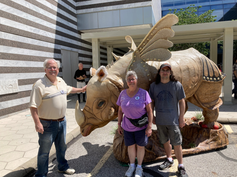 We pose with the Parade The Circle's rhinoceros with wings. A version of this rhino starts the parade every year!